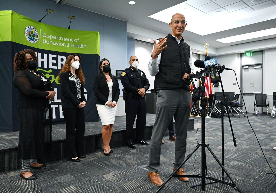 Dr. Mark Ghaly, Secretary of the California Health & Human Services Agency, right, speaks to the media after a CARE (Community Assistance, Recovery, and Empowerment) Court roundtable Thursday, March 17, 2022 in Fresno.