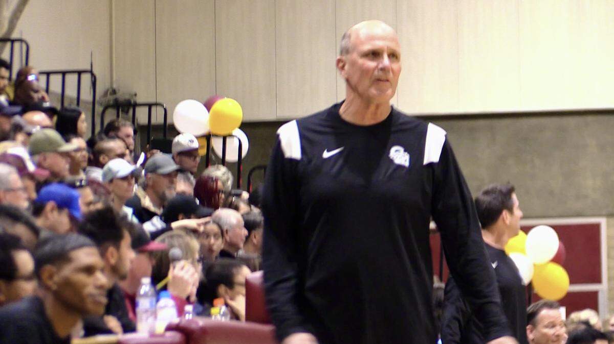 Former Clovis West boys basketball coach Vance Walberg, middle, while assistant Tyrone Jackson, left, looks on. Jackson was named the interim coach at Clovis West.
