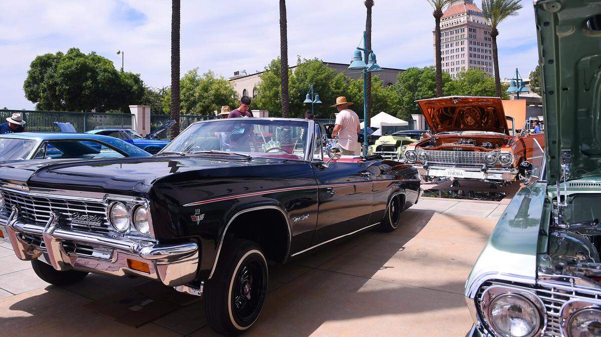 Lowriders are displayed inside the gate at Chukchansi Park for the Lowriders de Fresno car show Saturday, June 15, 2019 in Fresno. The Fresno Grizzlies baseball team, playing as the Lowriders de Fresno team, honored the tradition of lowrider car culture with a car, truck, bike and motorocycle show.