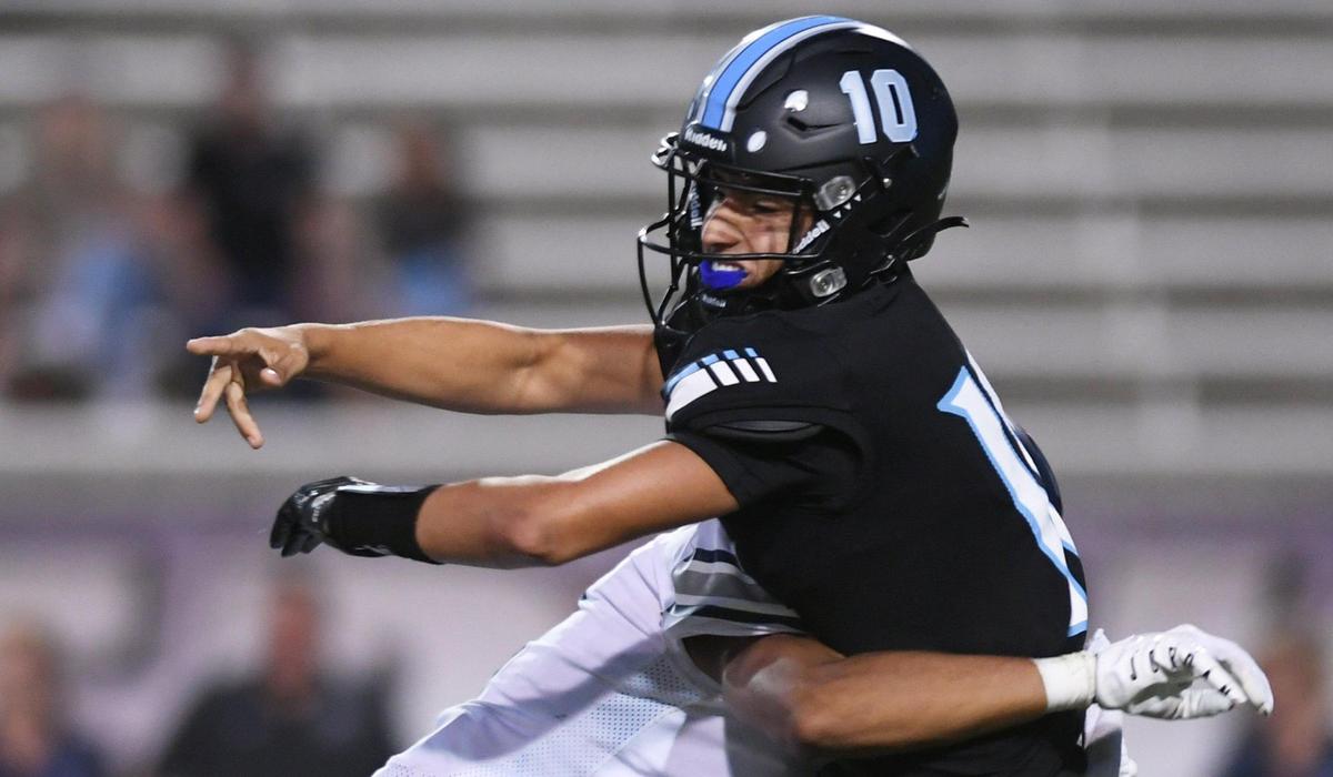Clovis East’s Amari Mazeke, background, hits Clovis North quarterback Mario Cosma Thursday, Sept. 30, 2022 in Clovis. Clovis North led 21-13 at halftime.