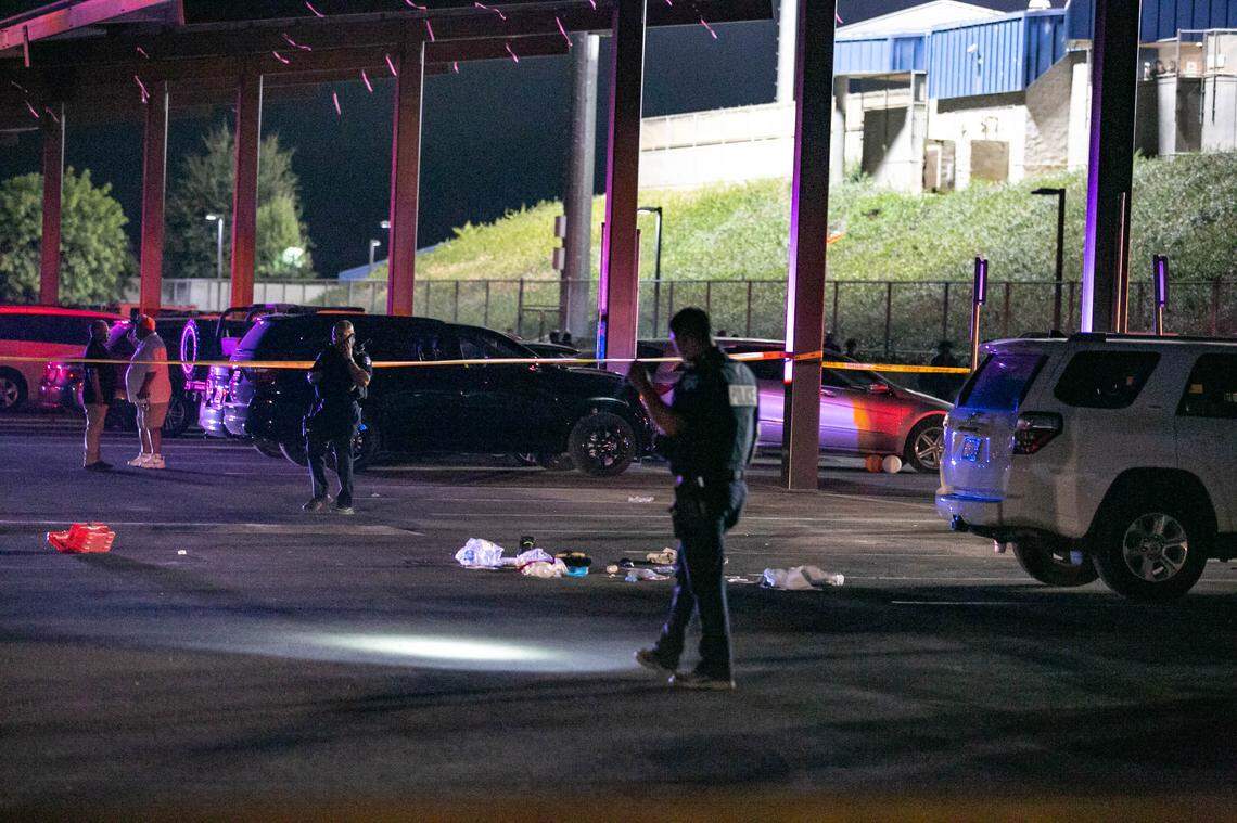Police investigate a shooting in the Koligian Stadium parking lot after a high school football game on Friday Aug. 20, 2021.