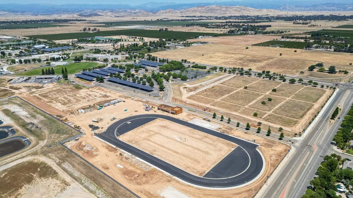 An all-weather competition track appears to take shape on what will be a new sports complex being constructed in what was an empty lot behind the main campus of Clovis Community College on the northeast corner of Behymer and Willow in north Fresno on Wednesday, June 10, 2026.