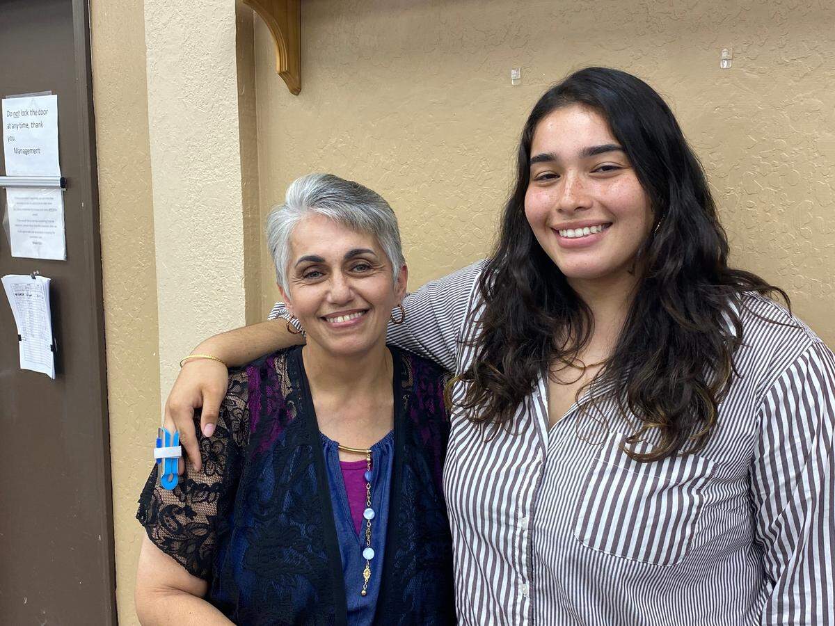 Rosemary Wanis, left, and daughter Rashelle Diaz pose for a photo on Sept. 4, 2024, at the Deaf and Hard of Hearing Service Center in Fresno. The pair shared their experience of having emergency surgery and the needs of the Deaf community.