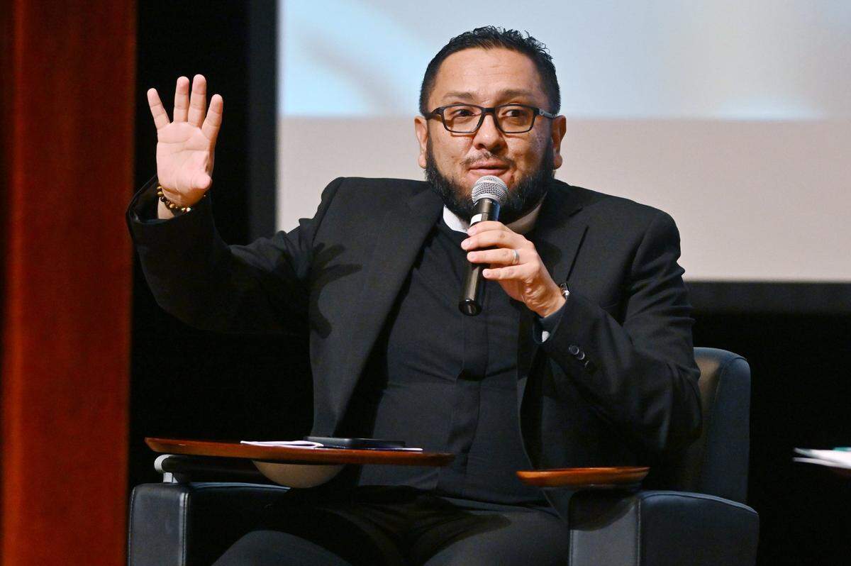Reverand Nelson Serrano Poveda answers a question in the second panel discussion at the Stop The Hate Townhall, held Thursday evening, Sept. 28, 2023 at Fresno City College’s Old Administration Building theater in Fresno. The forum featured three separate panel discussions addressing the impact of hate crimes in the Fresno LGBTQ+ community.