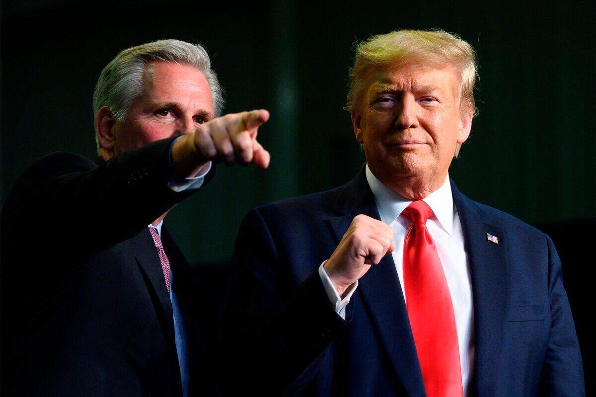 Then-President Donald Trump, right, gestures next to Rep. Kevin McCarthy, R-Bakersfield, as they deliver remarks to Rural Stakeholders on California Water Accessibility in Bakersfield in 2020.