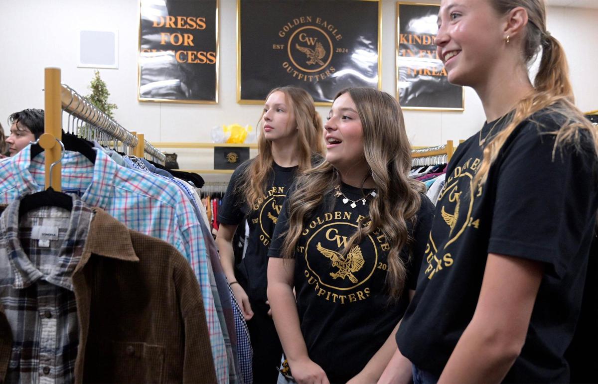 Student organizers view the clothing available at Clovis West’s new student store Golden Eagle Outfitters Thursday afternoon, Jan. 30, 2025 in Fresno. The store receives donated new and almost-new clothing for students, inspired by a past student’s need.