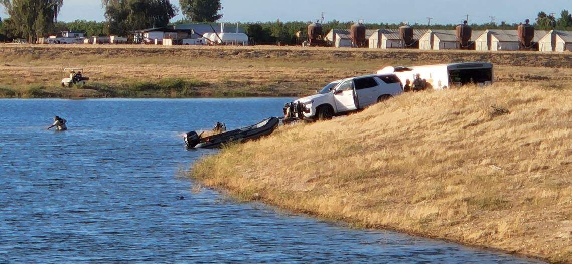Emergency workers search for a man who went underwater while swimming with his son and a friend Monday evening near Caruthers.