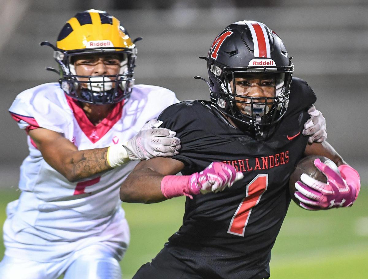 McLane’s Da’Zir Newhouse, right is grabbed by Sunnyside’s Malachi Barnes during a kickoff return in their football game at McLane Stadium on Friday, Oct. 21, 2022.