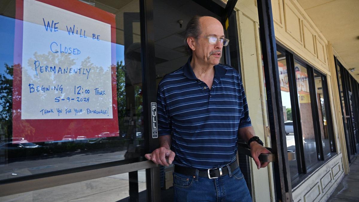 Tom Pearce, owner of Margie’s Hallmark Shop, continues clearing out the store his parents opened 37 years ago near Clovis Avenue and Kings Canyon Road Friday morning in Fresno. After decades of service, Pearce has closed the shop.