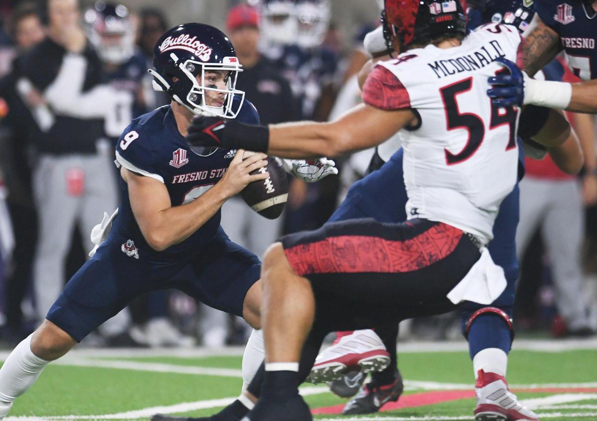 Fresno State quarterback Jake Haener scrambles away from pressure against San Diego State Saturday, Oct. 29, 2022 in Fresno.