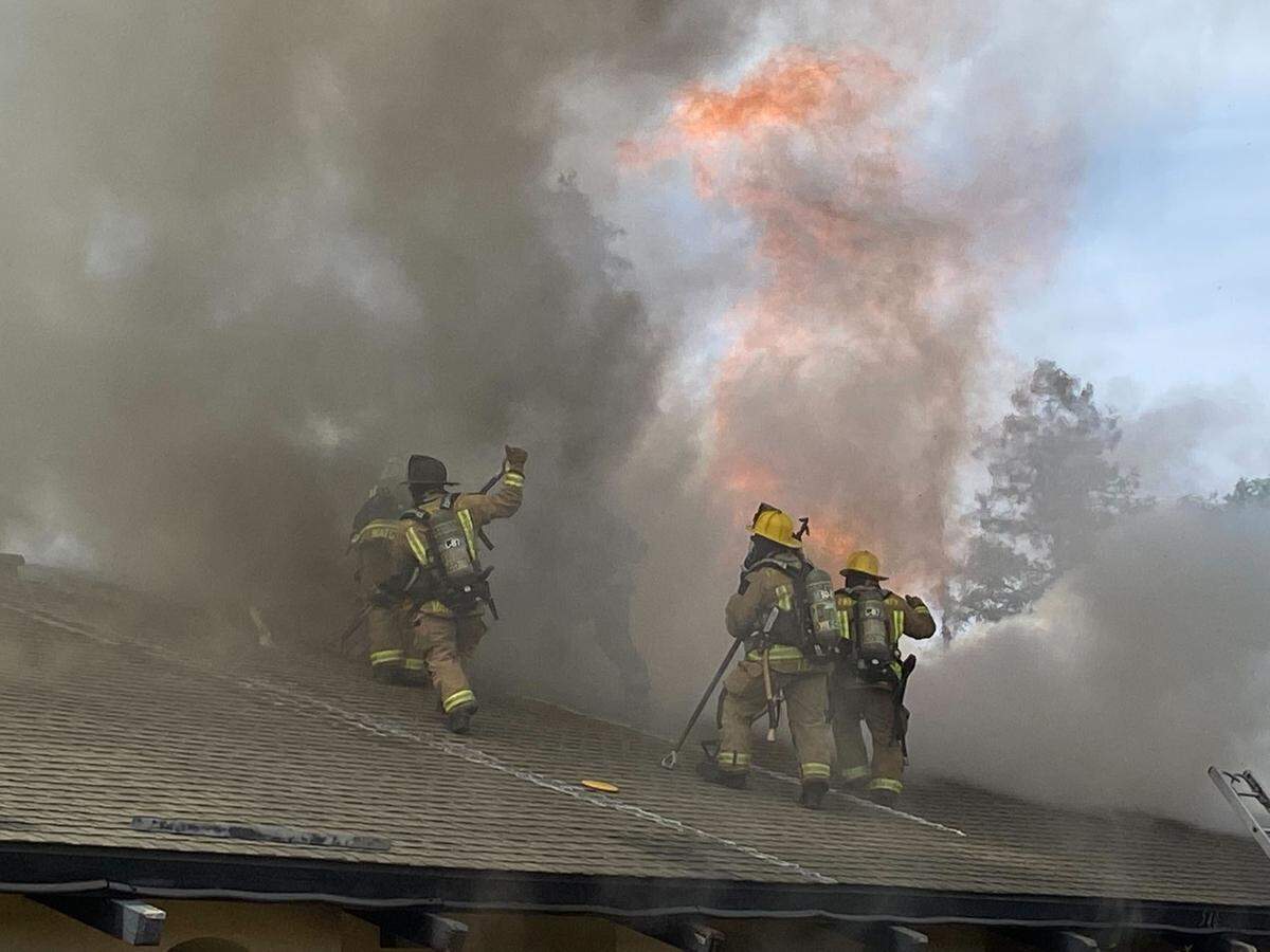 Flames coming from the roof of an apartment on Argyle Avenue in southeast Fresno.