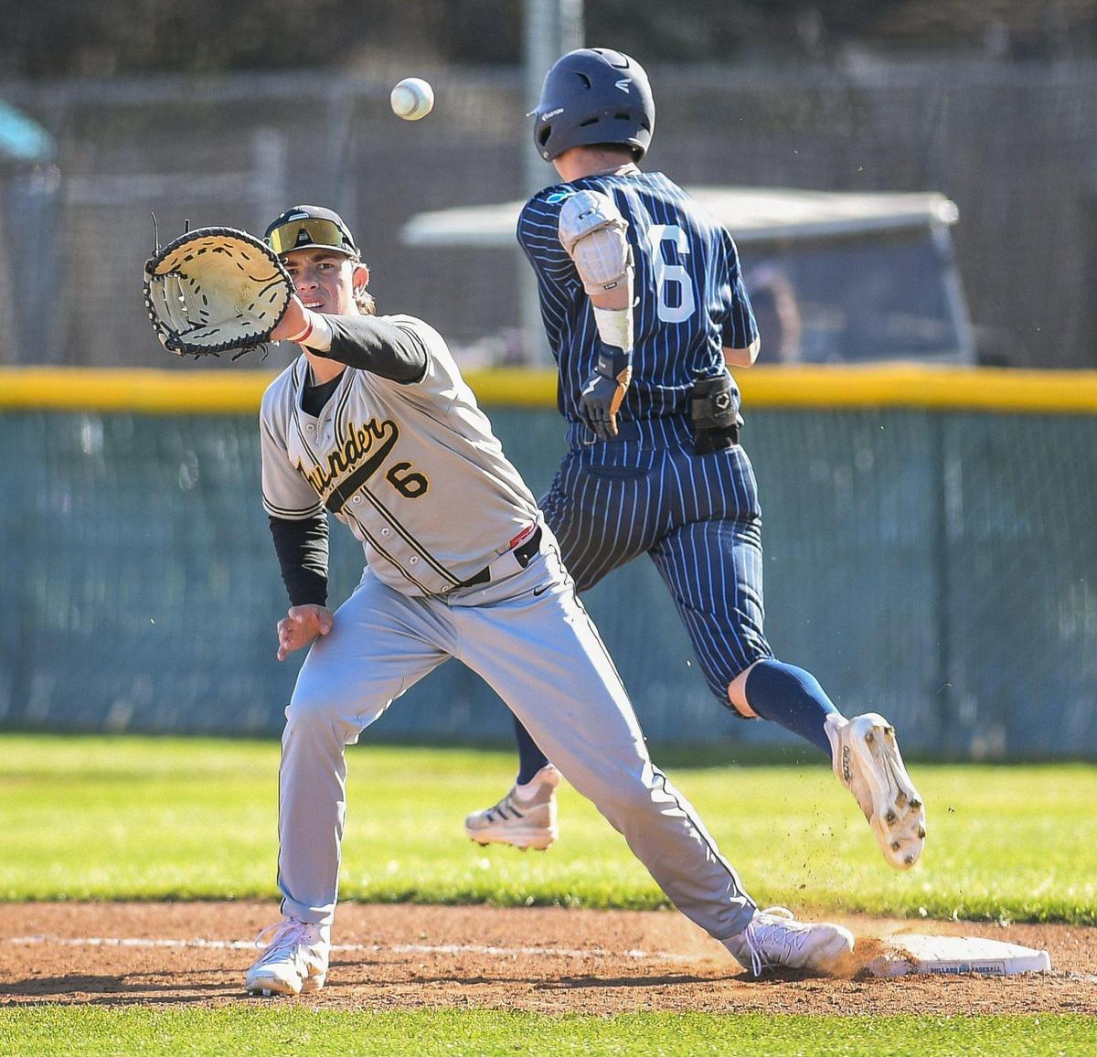 Bullard’s Trevor Wilson, right, reaches first base safely before Buhach Colony’s Spencer Lanz catches the throw in their game at Bullard High School on Monday, April 3, 2023.
