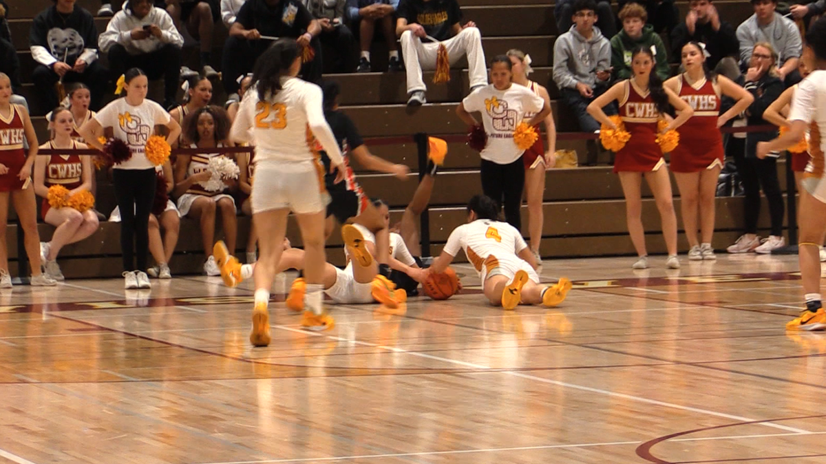 Players dive for the ball between Clovis West and Central in a Central Section Division I girls basketball semifinal game on Thursday, Feb. 20, 2025.