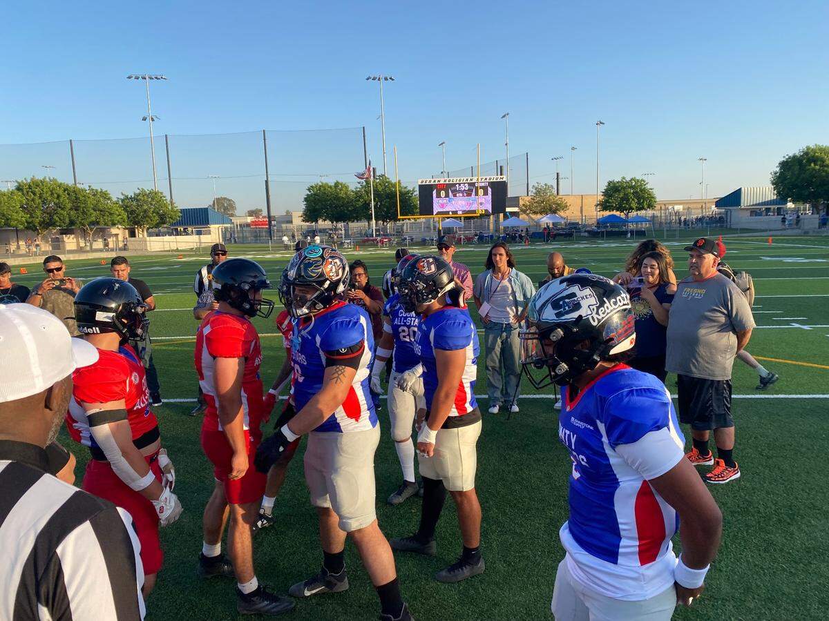 Players from the City/County All-Star game greet each other at midfield on Friday, June 20, 2025.