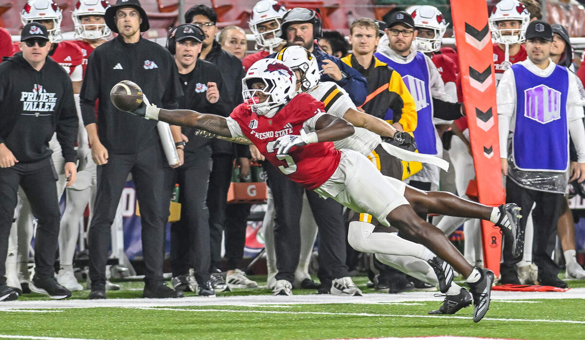 Fresno State’s Al'zillion Hamilton steps in front of Wyoming’s Jaylen Sargent to knock the ball away for an incomplete pass during their game at Valley Children’s Stadium on Saturday, Nov. 16, 2025.