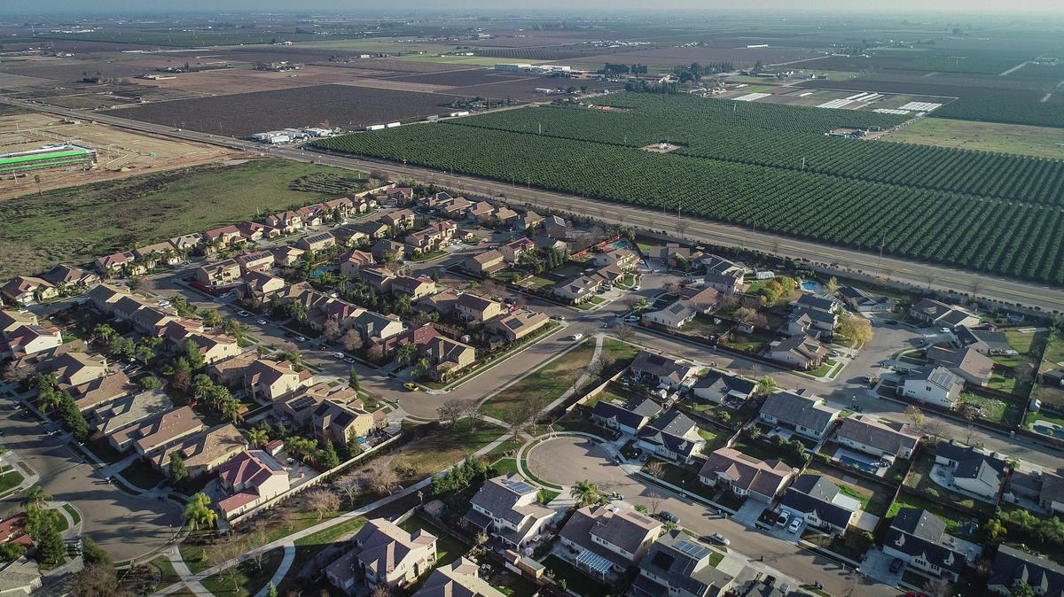 Recent home construction is seen where it meets rural farmland southeast of Fresno at Jensen and Fowler avenues near the 93725 zip code in this drone image made on Friday, Jan. 3, 2019. The 93725 zip code has seen Fresno’s largest jump in home prices over the last decade.