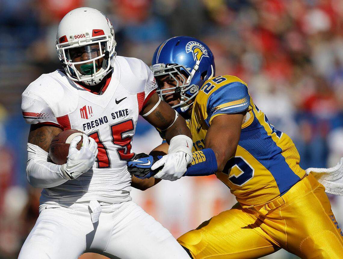 Fresno State wide receiver Davante Adams (15) breaks a tackle by San Jose State cornerback Akeem King (25) during the first half of an NCAA college football game on Friday, Nov. 29, 2013, in San Jose, Calif.