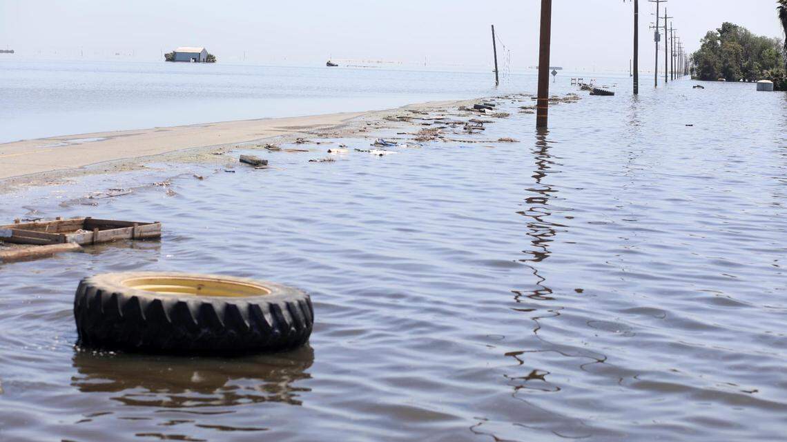 Southbound 6th Avenue as it disappears beneath the widespread flooding Tuesday, April 25, 2023 south of the City of Corcoran where flooding is re-creating the old Tulare Lake.