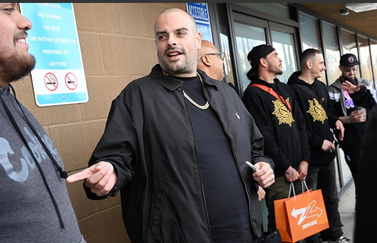 Cookies CEO Berner, born Gilbert Anthony Milam, Jr., center, attends the grand opening of Cookies, Fresno’s newest cannabis dispensary Sunday morning, Dec. 17, 2023.
