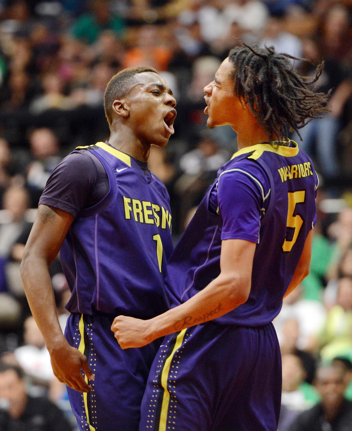 Fresno High’s J’Veon Jones, left, and Daryl Edwards celebrate after a basket against Roosevelt in their boys Division III Central Section championship game at Selland Arena Saturday, March 8, 2014.