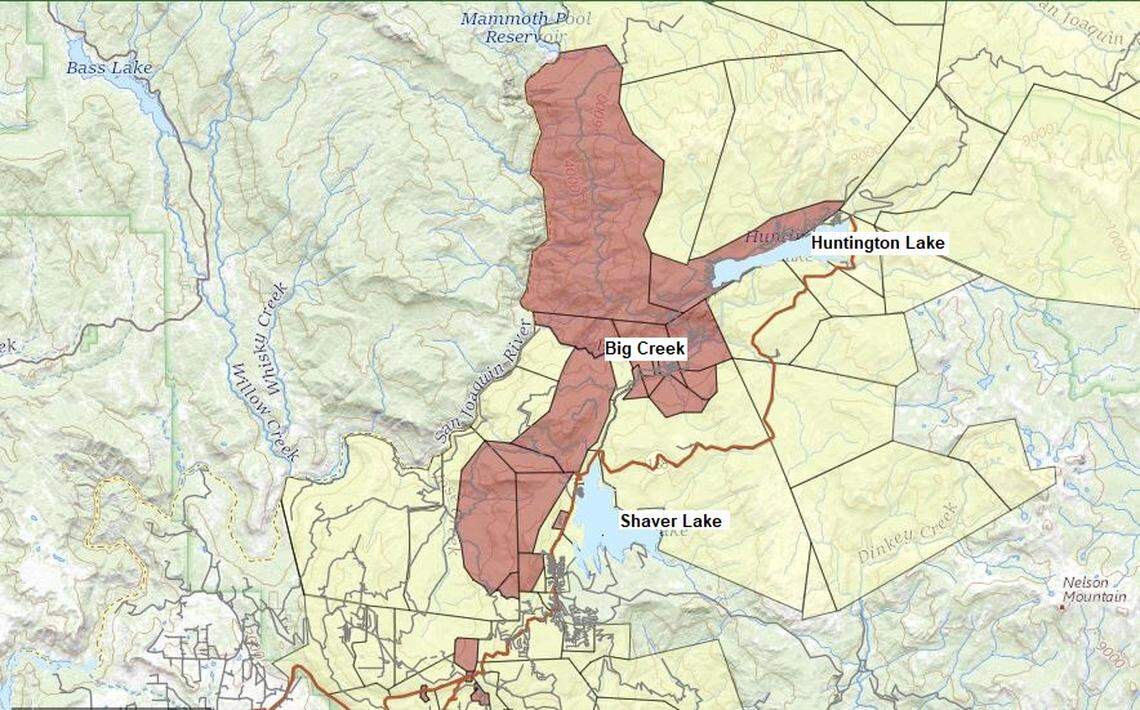A map from the Fresno County Sheriff’s Office shows areas of “extreme risk” in red for flooding or debris in the area burned by the 2020 Creek Fire. Areas at “high risk” are shown in yellow on the map.
