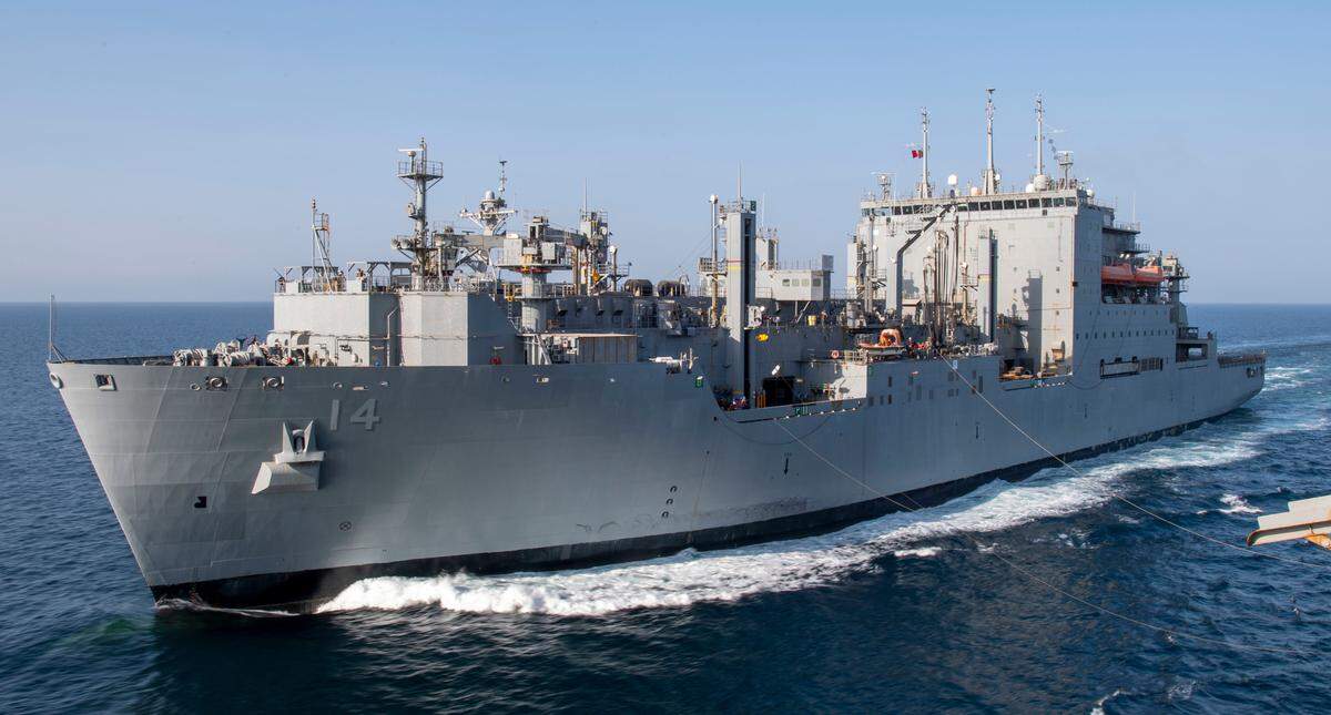 The dry cargo and ammunition ship USNS Cesar Chavez (T-AKE 14) conducts a replenishment-at-sea with an amphibious assault ship in November 2021. The Trump administration wants to rename the ship, which was launched in 2016.