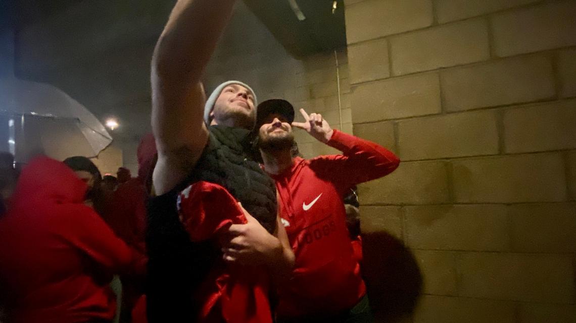 Fresno State QB Jake Haener takes a selfie with a fan as the Bulldogs returned to Fresno following a 28-16 win over Boise State for the Mountain West championship on Saturday, Dec. 3, 2022.