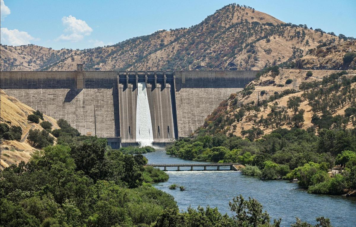 Pine Flat dam is showing releases over the dam spillway and into the Kings River on Wednesday, July 19, 2023 with the lake reaching capacity after historic Sierra Nevada snowfall last winter and spring.