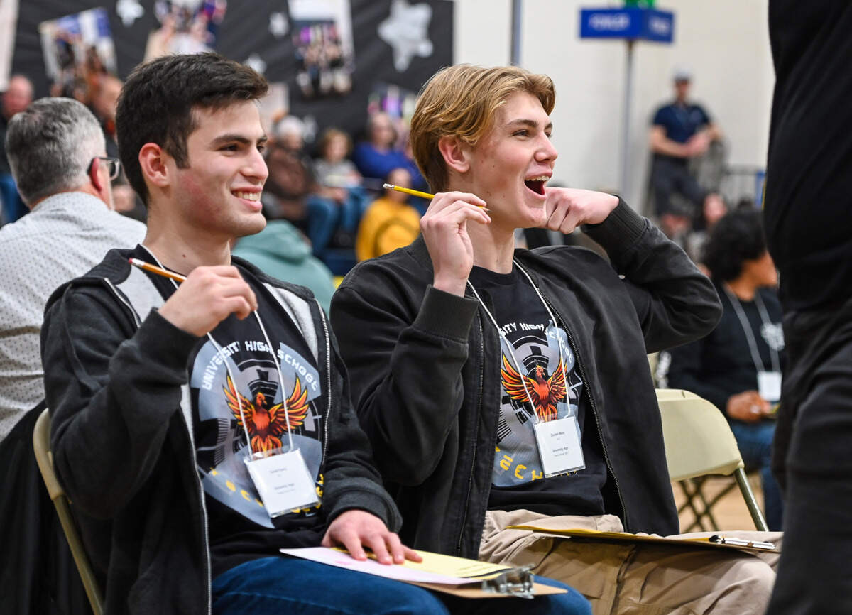 University High School Academic Decathlon team members Daniel Fierro, left, and Cayden Ward show signs of relief after scoring correct answers during the Super Quiz portion of the 42nd annual Fresno County Academic Decathlon on Saturday, Feb. 3 2024.