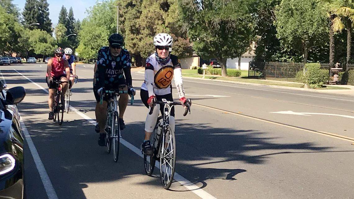Cyclists use a bike lane on Audubon Drive in Fresno.
