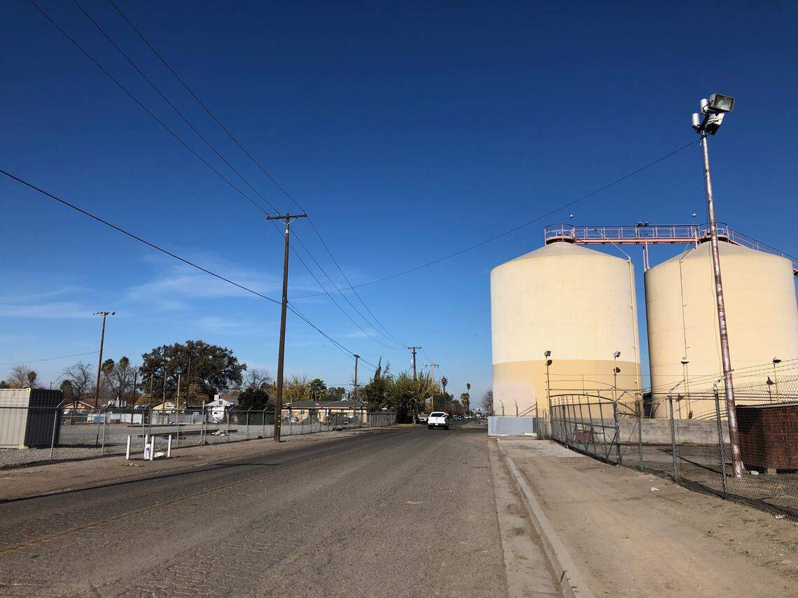 Homes sit across the street from large industrial areas in Calwa, a small community south of Fresno, CA.