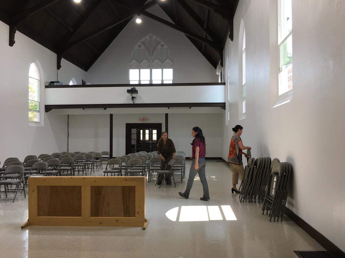 Members of the World Society Church of God in Fresno, California stack chairs on Tuesday, Aug. 7, 2018 in order to clean the floors before evening service. The church has faced online rumors about human trafficking that church members say are not true. Police in Fresno have not been able to find credible evidence of the rumors.