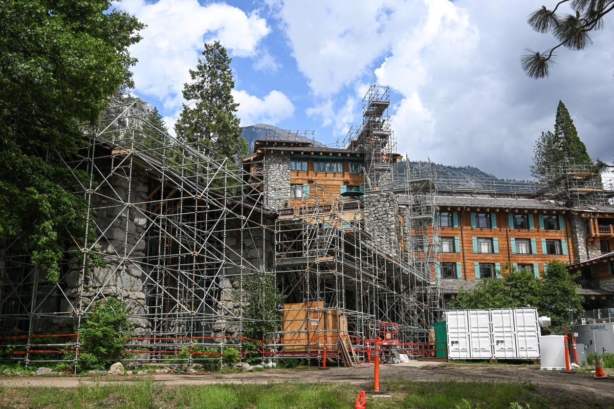 Scaffolding covers the Ahwahnee Hotel during construction on “structural enhancements” in Yosemite Valley on Tuesday, June 13, 2023. Construction is expected to be completed by the fall.