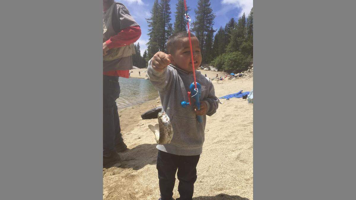 Vincent Valenzuela shows off his first fish, caught June 7 at Shaver Lake. Vincent’s dad, Luis Valenzuela, says his son was doing everything he did – but Vincent didn’t get the line reeled all the way in before setting down the pole and walking away. Luis writes, “As I was baiting my line a fish broke water in front of me, so I called him over and sure enough he got one. #firstTrout #shaverLake #proudDaD #moreFishingTrip”