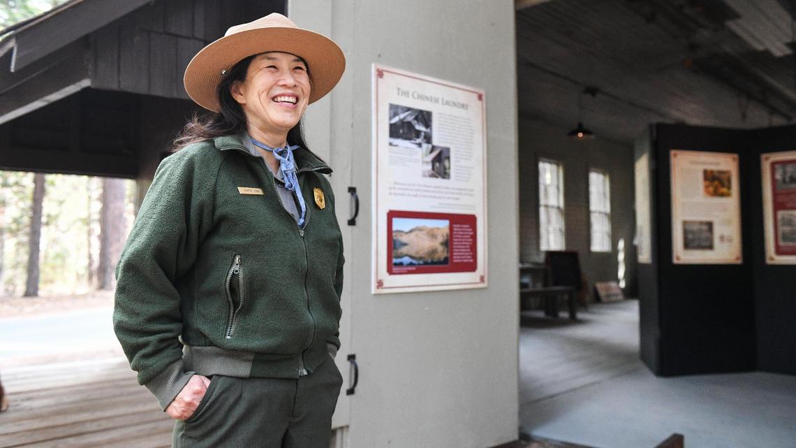 Yosmemite National Park ranger Yenyen Chan stands outside the Chinese Laundry Building near the Yosemite History Center in Yosemite’s Wawona on Tuesday, Sept. 28, 2021. The building is being dedicated in honor of its original purpose as a laundry building for the Wawona Hotel and the Chinese immigrants who ran it.