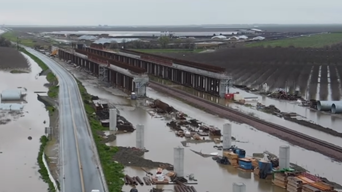 Flood waters from recent storms and river runoff surround the construction site of the Tule River high-speed rail viaduct near Highway 43 and Avenue 144 south of Corcoran, California on March 22, 2023.