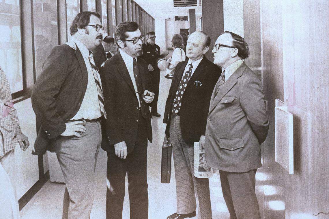 The Fresno Bee newsmen sentenced to jail in April 1975 for refusing to tell the source of sealed grand jury testimony. Here they discuss their appeal outside Superior Court Judge Denver C. Peckinpah’s courtroom. From left are reporter Joe Rosato Sr., City Editor James H. Bort Jr., Managing Editor George F. Gruner and reporter William K. Patterson.