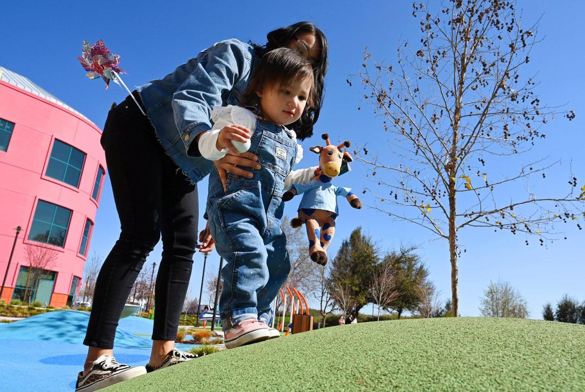 Willow Vander Laan, 1, plays with her mom Angelica Hernandez at Valley Children’s Hospital Friday, Feb. 25, 2022 near Madera. Willow was diagnosed with Spinal Muscular Atrophy.
