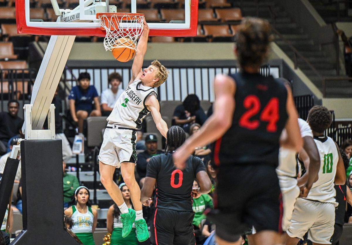 St. Joseph's Gunner Morinini dunks the ball on a fast break against Buchanan during their Central Section Division 1 boys basketball championship game at Selland Arena on Saturday, Feb. 28, 2026.