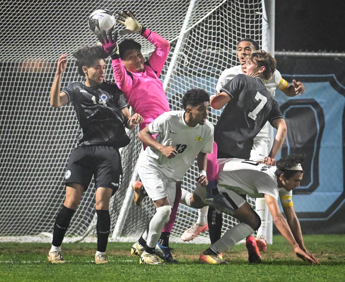 Edison goal keeper Angel Hernandez tries to block the ball on a scoring attempt by Clovis North in the first half of their Division 1 soccer final at Clovis North on Thursday, Feb. 27, 2025.
