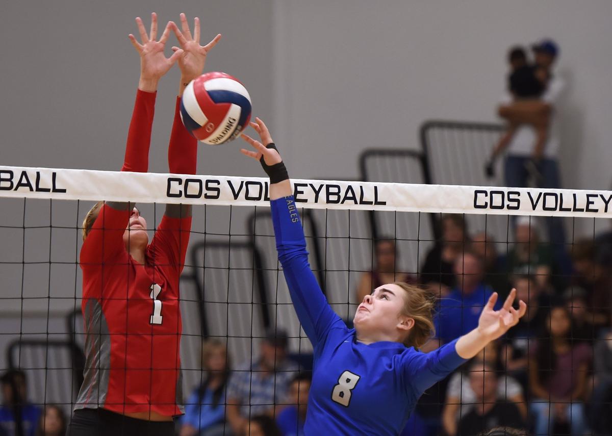 Immanuel’s Brooke Hatch, right, with Chowchilla’s Kinsley Vlot, left, at the Central Section girls volleyball championships held at College of the Sequoias Saturday, Nov. 3, 2018 in Visalia.