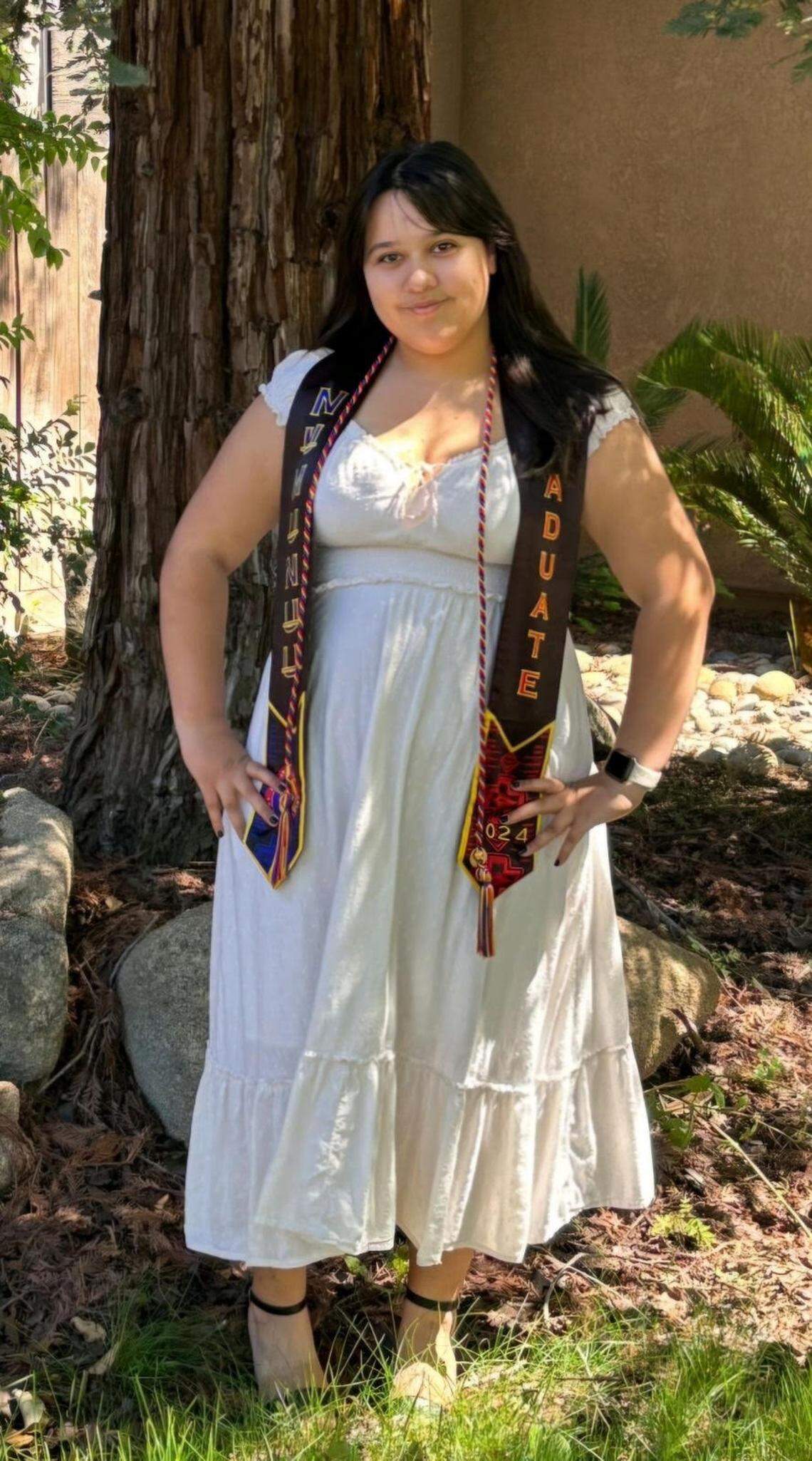 Jennie Rocha, a Clovis North senior with Indigenous heritage, poses with the stole the Comanche Nation gifted her for graduating in 2024. Clovis Unified School District initially did not allow Rocha to wear the stole, questioning if the lettering “GRADUATE 2024” was related to Comanche culture. After discussing with the district and defending their rights, the Rocha family is proud Jennie will be able to attend her graduation on June 4 with her stole.