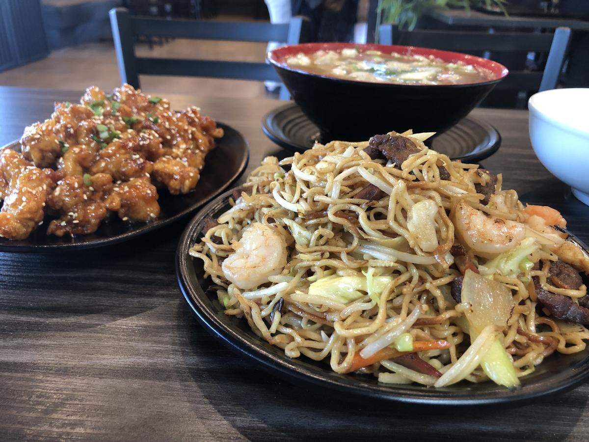 The chow mein, right, and other dishes are pictured at Dragon Wok, a fast casual Chinese restaurant in northeast Fresno.
