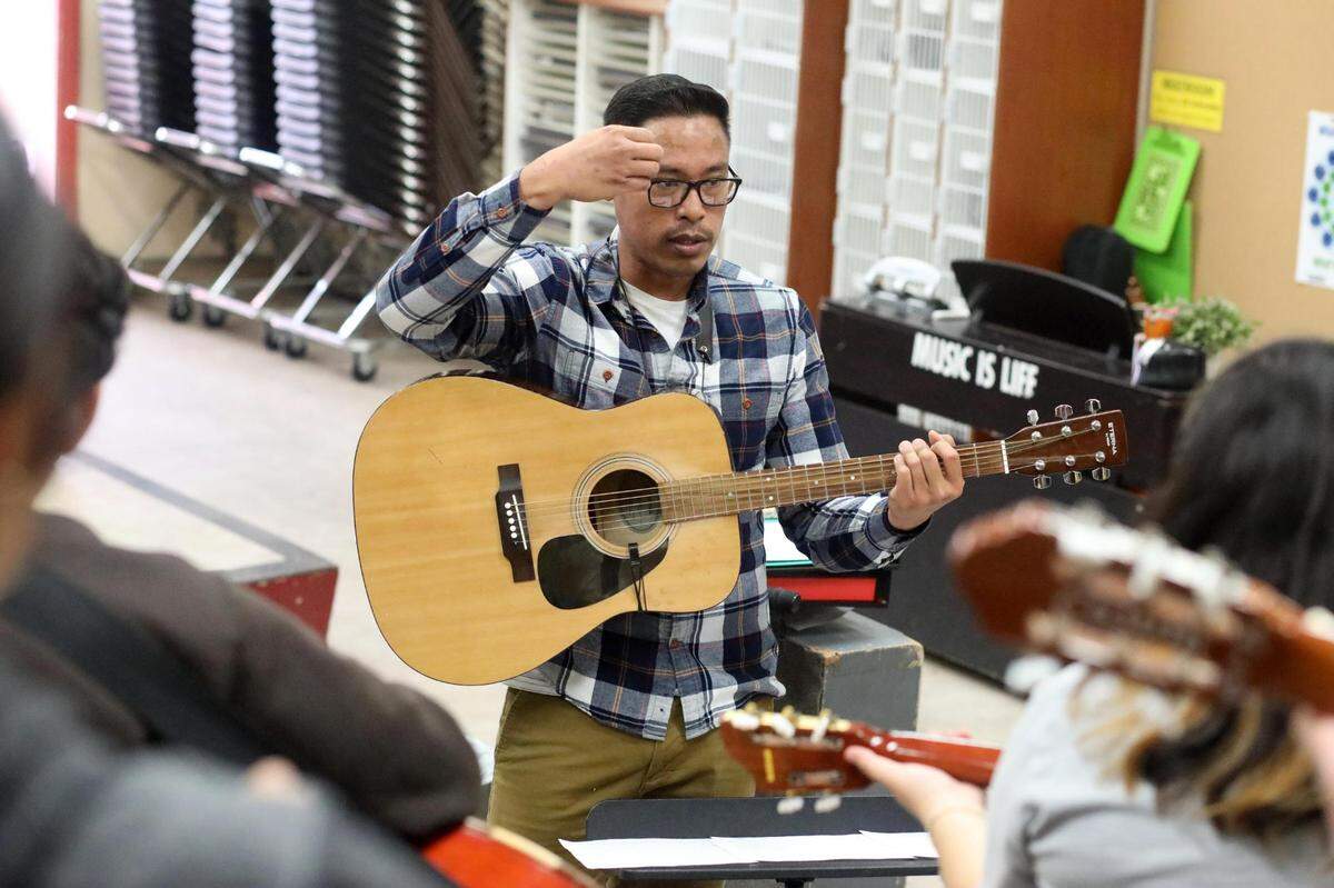 Orosi High School mariachi band director Jonathan Gaspar during the mariachi class on Wednesday, March 15, 2023.