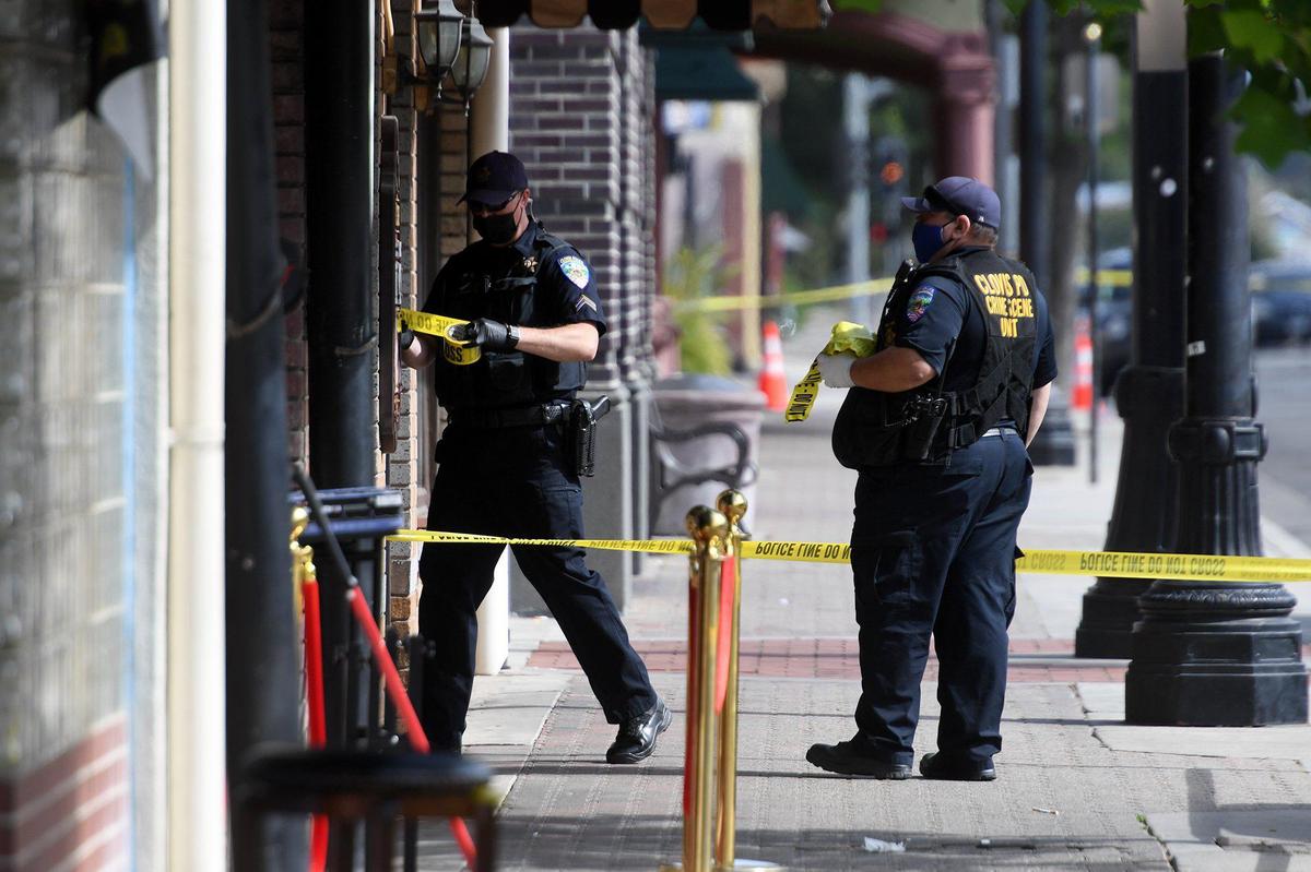 Clovis Police secure the scene of a fatal shooting at The Palace bar at 446 Clovis Ave. on Saturday morning, May 22, 2021. Two men were killed and another injured.