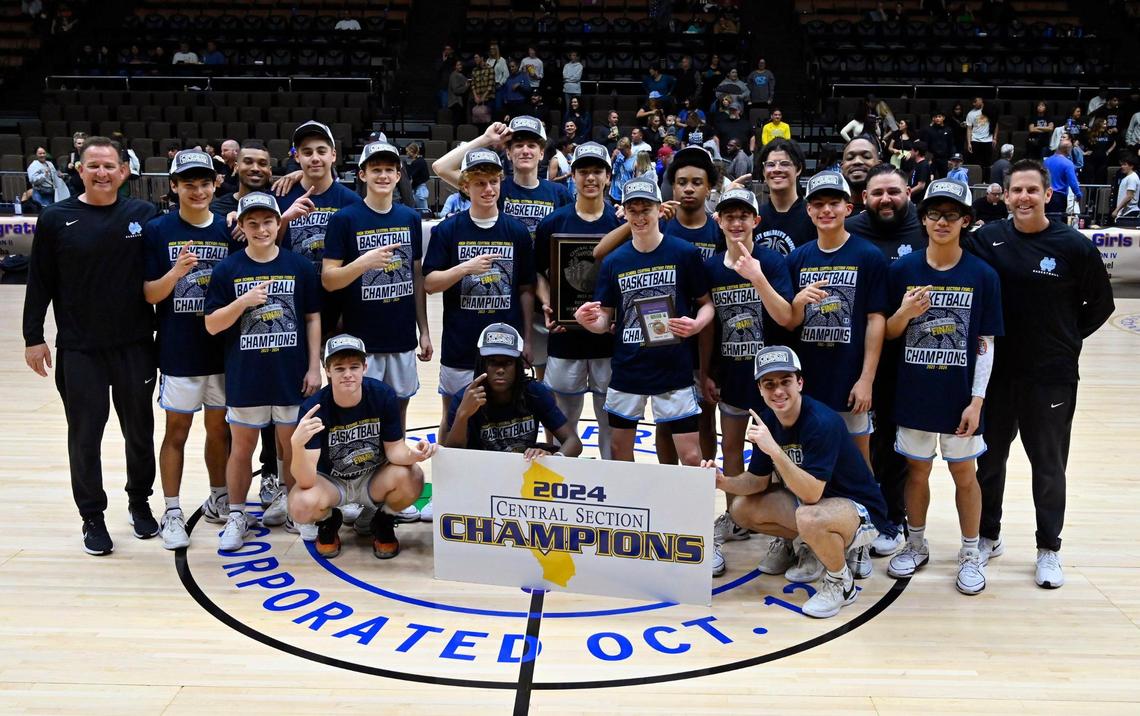 Clovis North poses for a photo after defeating St. Joseph 69-60 in the Central Section Division I basketball championship Saturday, Feb. 24, 2024 at Selland Arena in Fresno.