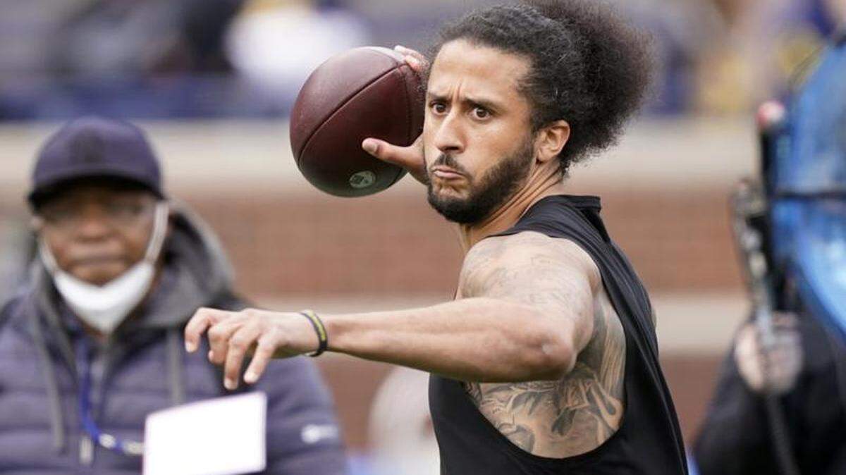 Colin Kaepernick throws during halftime of a University of Michigan intrasquad spring game on April 2, 2022, in Ann Arbor. Kaepernick worked out with the Las Vegas Raiders on Wednesday, May 25, 2022, but the team has not yet said if it is interested in signing the former San Francisco 49ers star.