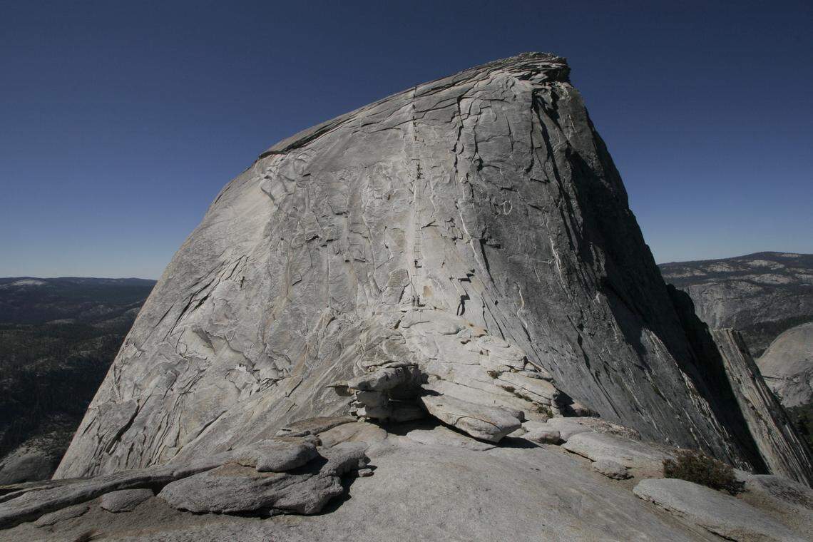 The east face of Half Dome, as seen from the top of the granite staircase. The cables section climbs the final 400 feet to the summit and is as steep as 45 degrees.