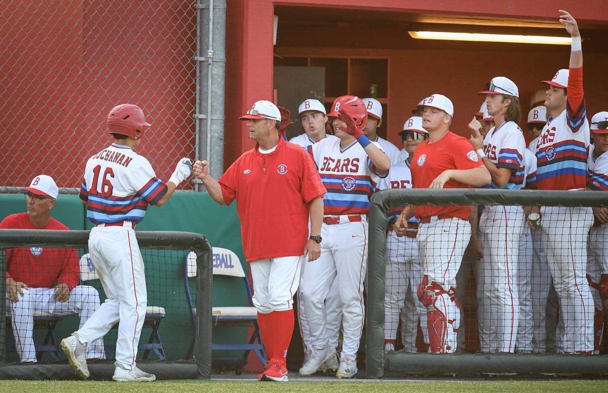 Buchanan’s Justin Inchaurregui, left, is congratulated by coach Brad Fontes and the rest of the team after scoring against Central High in their game at Buchanan on Friday, April 29, 2022.