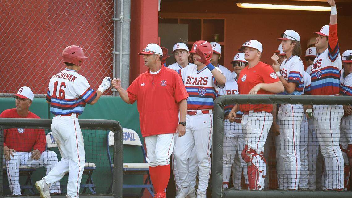 Buchanan’s Justin Inchaurregui, left, is congratulated by coach Brad Fontes and the rest of the team after scoring against Central High in their game at Buchanan on Friday, April 29, 2022.